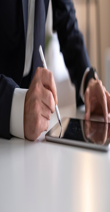 Businessman Signing Digital Contract On Tablet 
