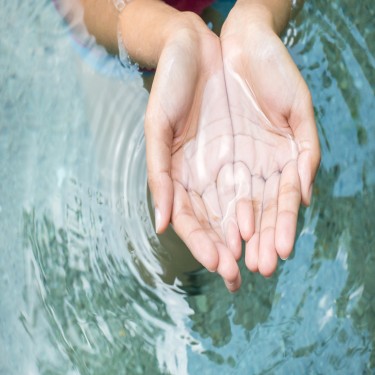 clear water in woman hands