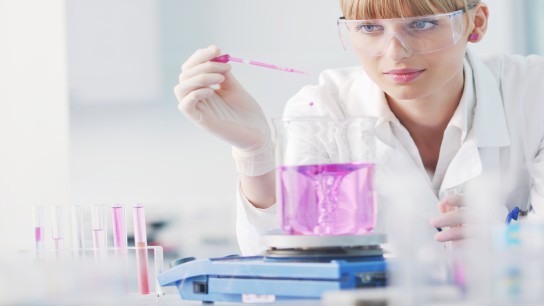   Female scientist doing experiments in a lab